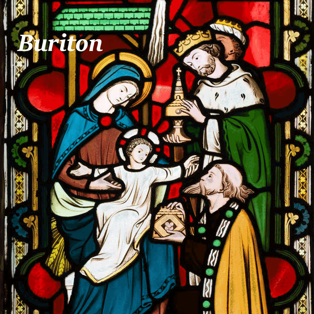 Stained glass window depicting the Wise men with their gifts of gold, frankincense and myrrh visiting Mary and the baby Jesus in the stable.