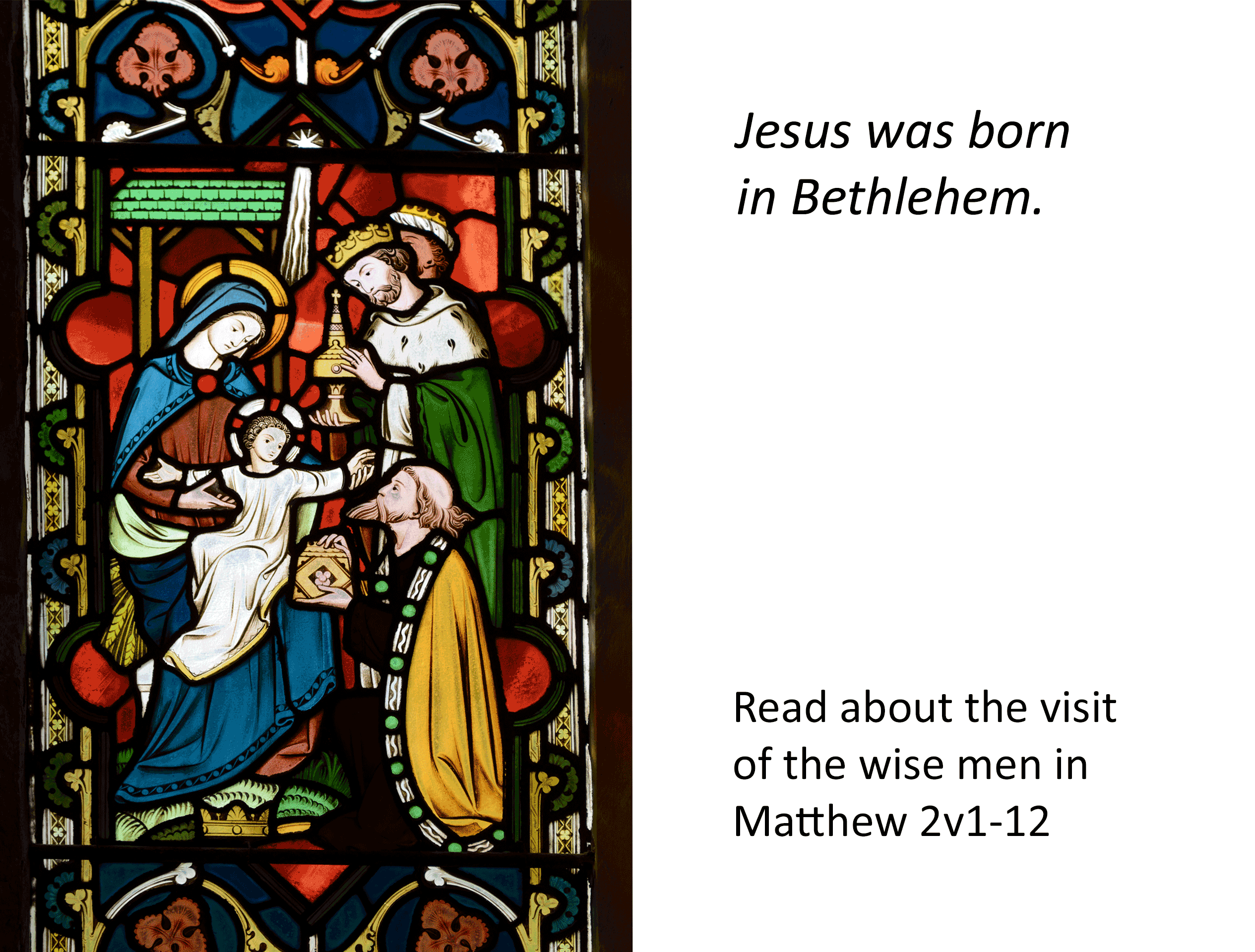 Jesus born stained glass depicitng Jesus, his mother Mary and the visit by the Kings (Wise men)