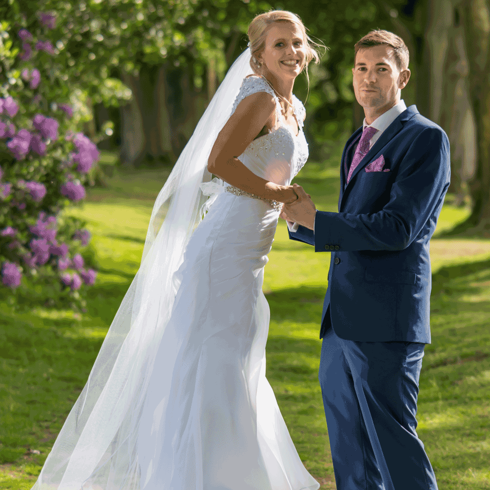 Wedding couple, she is a PE teacher and is jumping