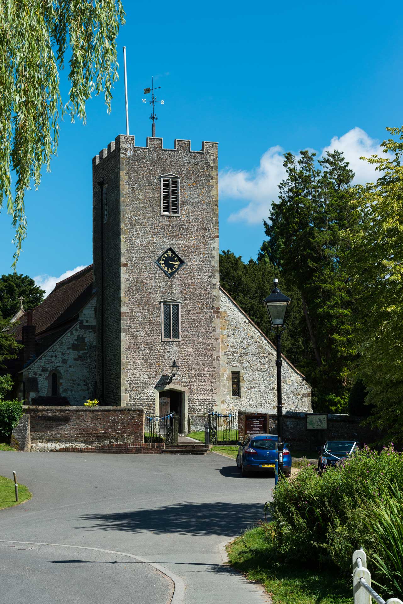 Church tower and clock showing quarter past three, wind blowing from the North East