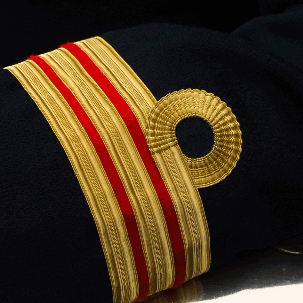 Naval surgeon Commander's sleeve with the red bands.